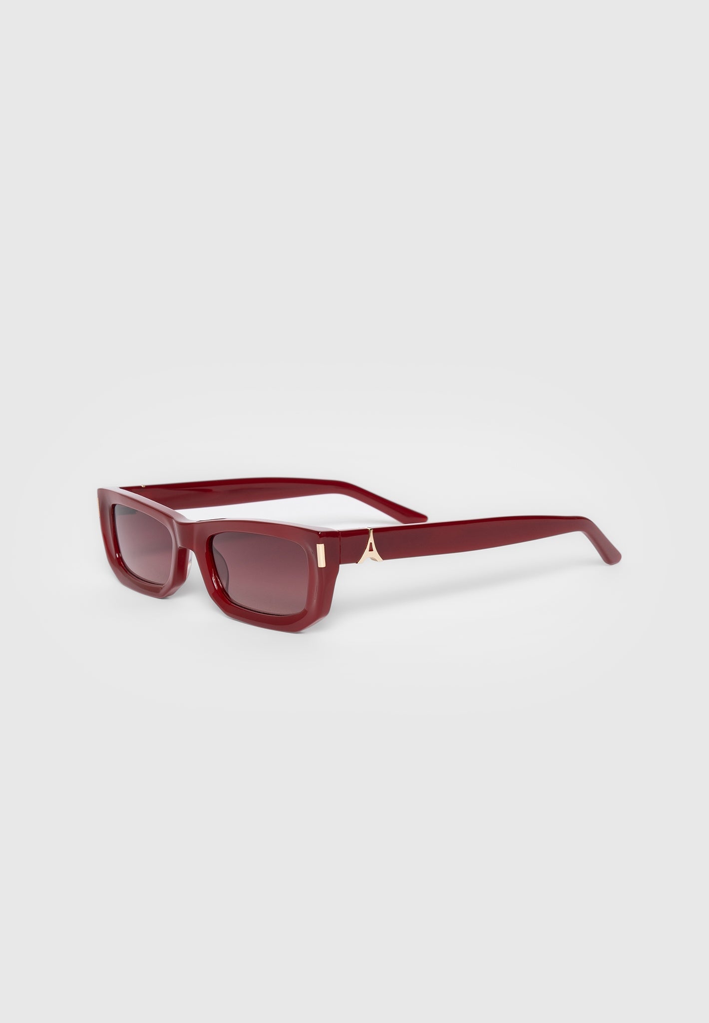Red Curved-Frame Sunglasses with UV Protection | Manière De Voir