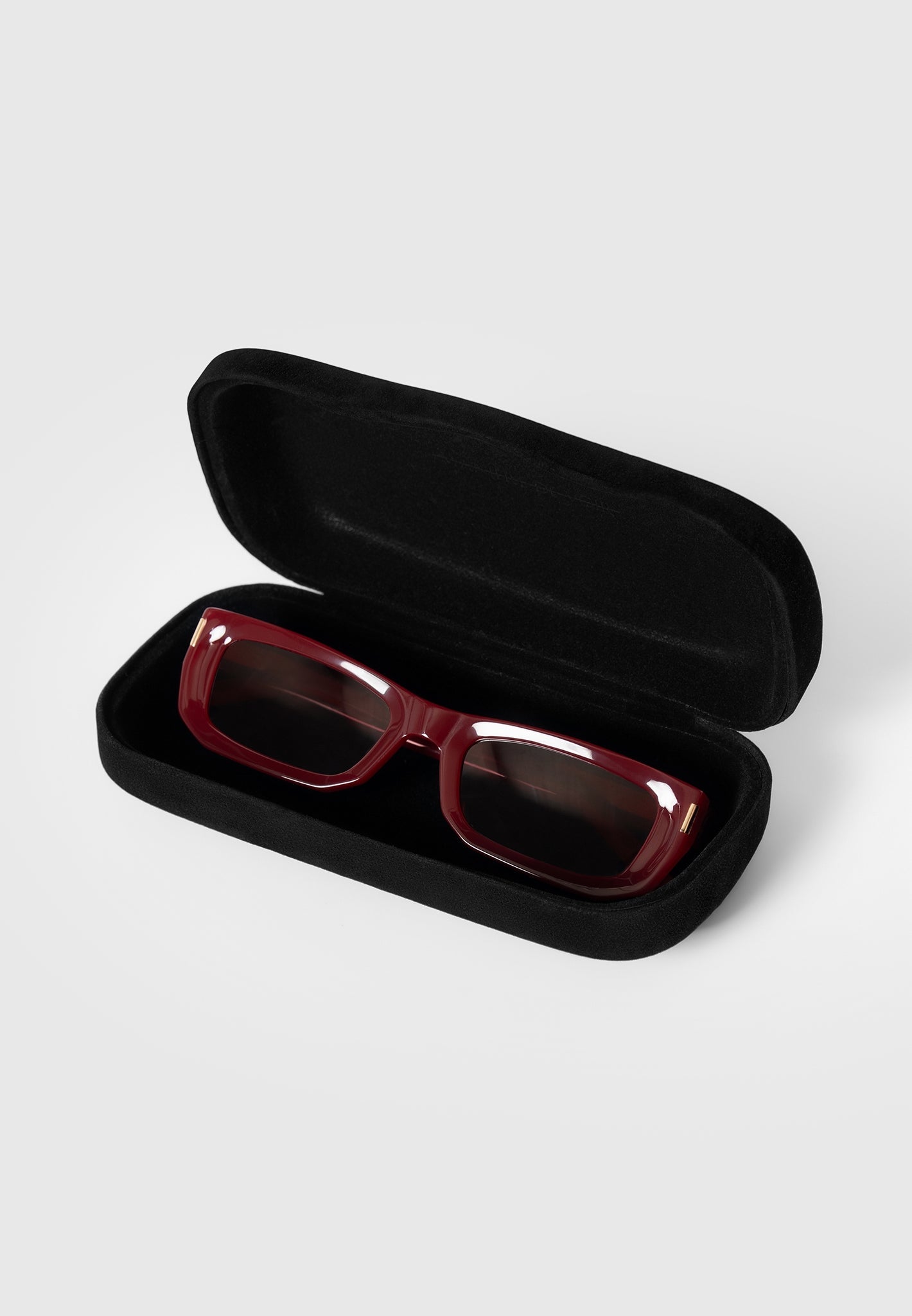 Red Curved-Frame Sunglasses with UV Protection | Manière De Voir