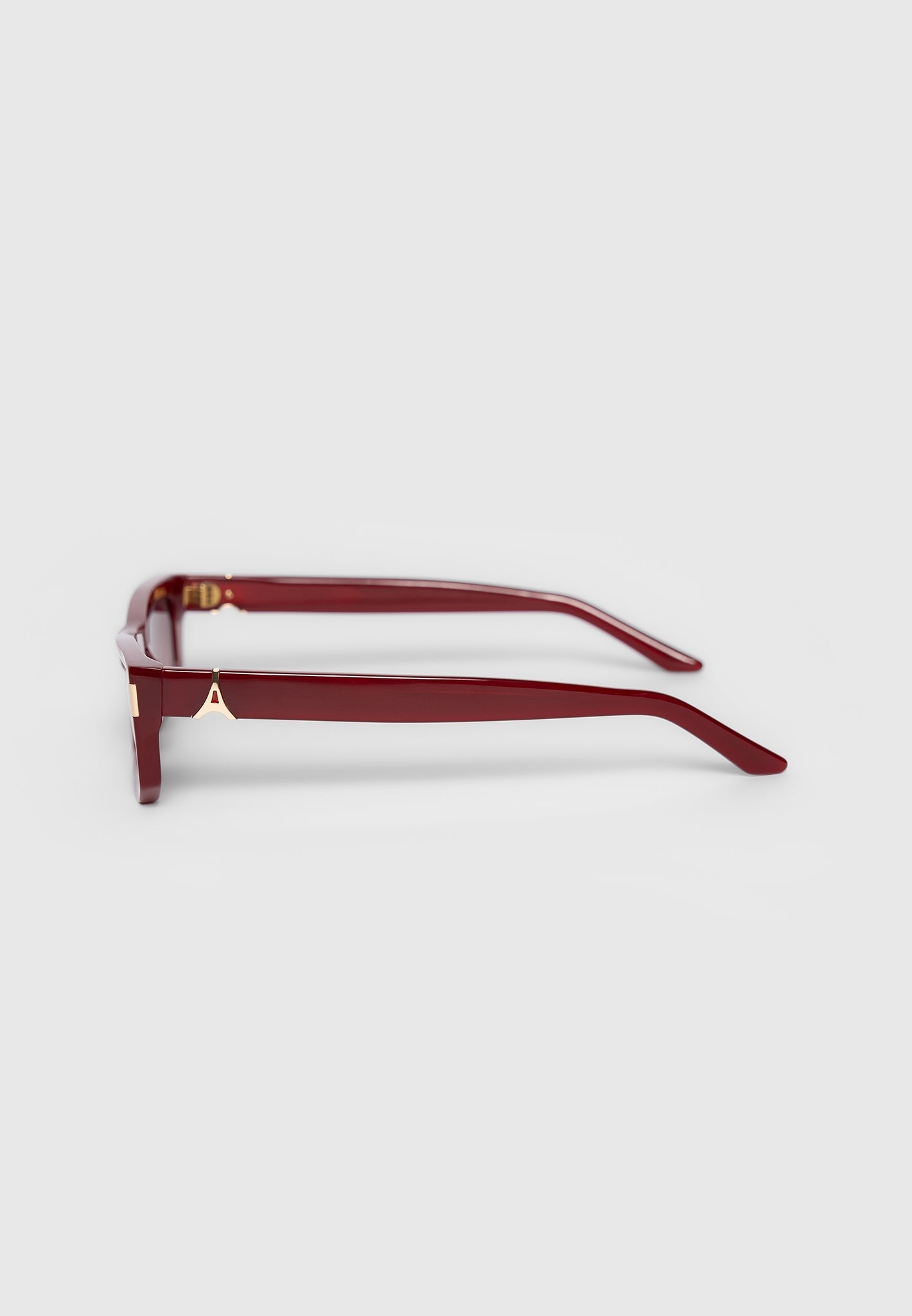 Red Curved-Frame Sunglasses with UV Protection | Manière De Voir