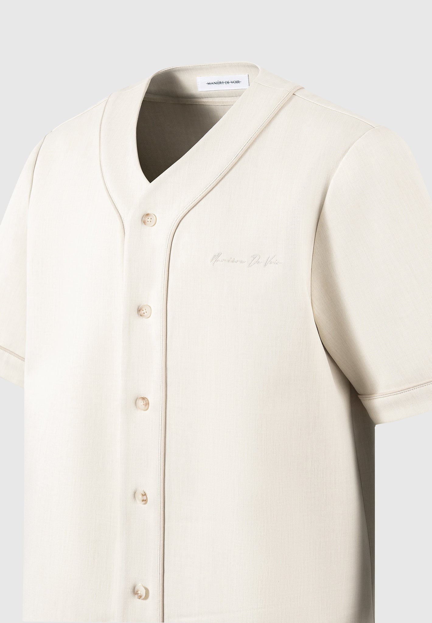 Boxy Baseball Shirt with V-Neck & Contrast Embroidery | Manière De Voir