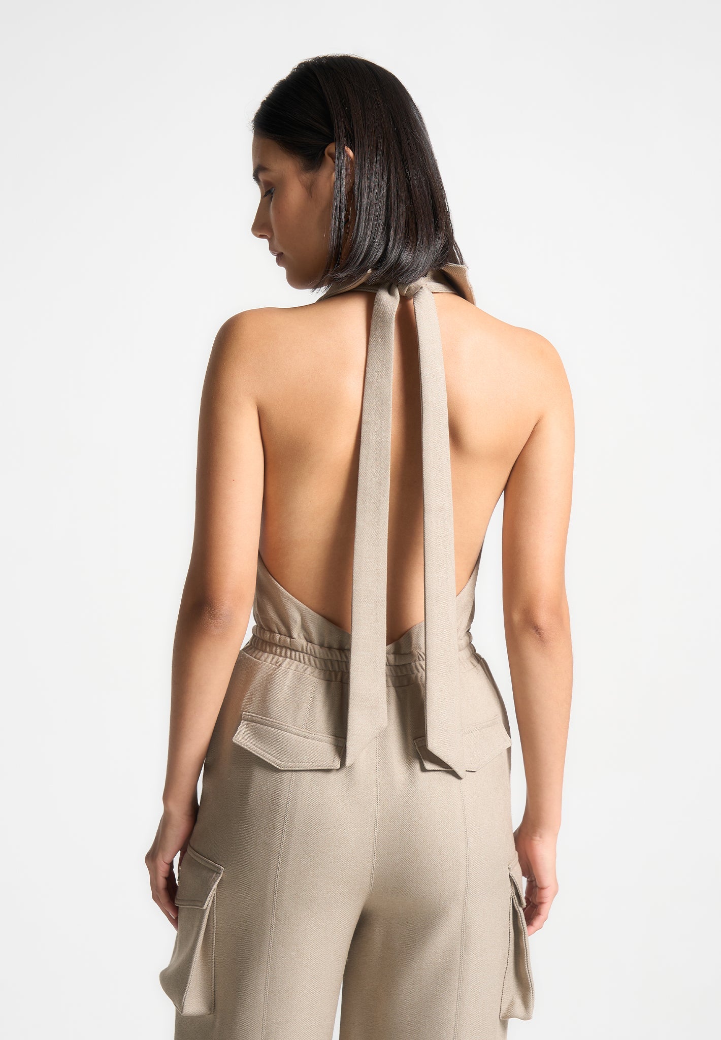 Beige Halterneck Cargo Jumpsuit with Tie Neck & Pockets | Manière De Voir