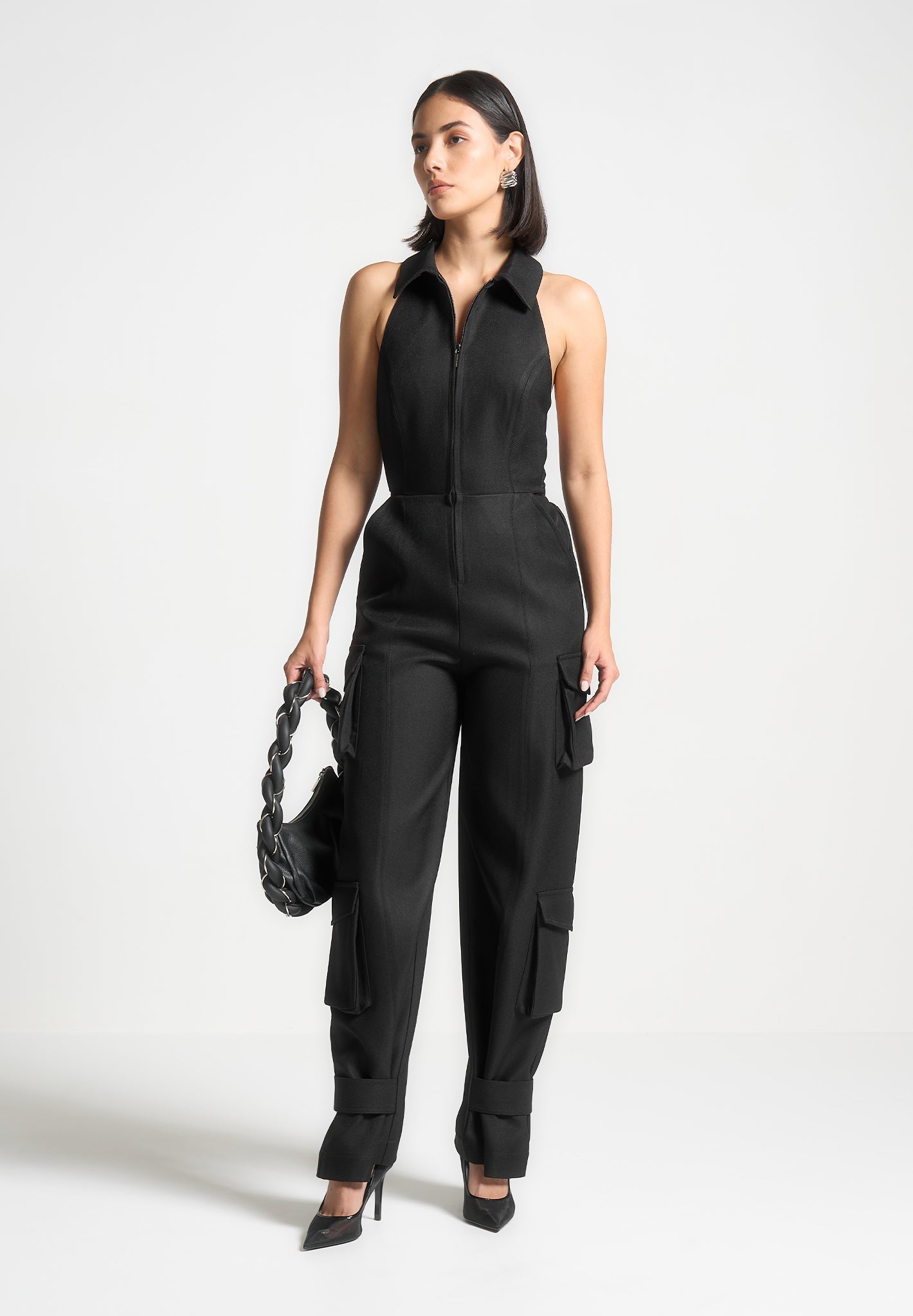 Black Halterneck Cargo Jumpsuit with Adjustable Tie Neck | Manière De Voir
